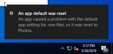 An app default was reset" to photos. - Windows 10